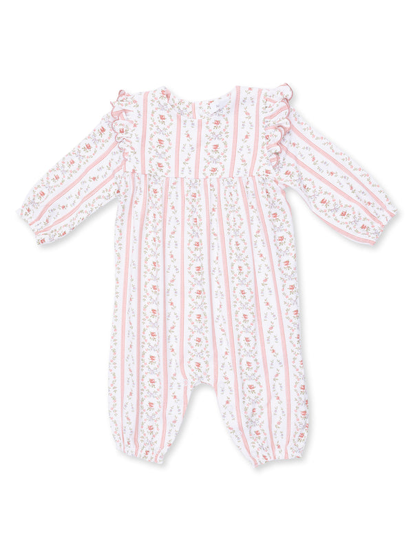 White infant romper with pink floral and striped patterns, featuring ruffled sleeves and elasticized cuffs.