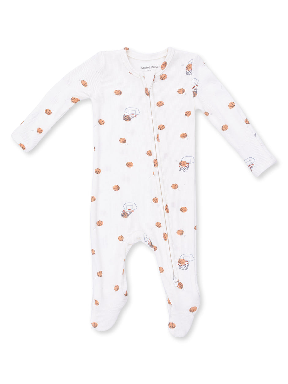 White baby onesie with basketball and hoop pattern, featuring a front zipper and long sleeves.