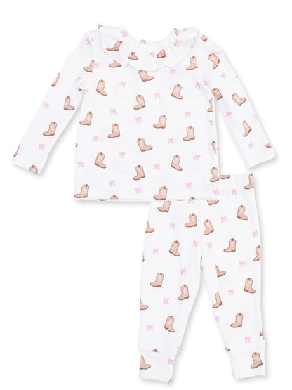 White long-sleeve pajama set with boot and pink bow prints for children. Cozy and stylish sleepwear option.