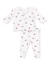White baby outfit featuring a long-sleeve top and pants with a football print.