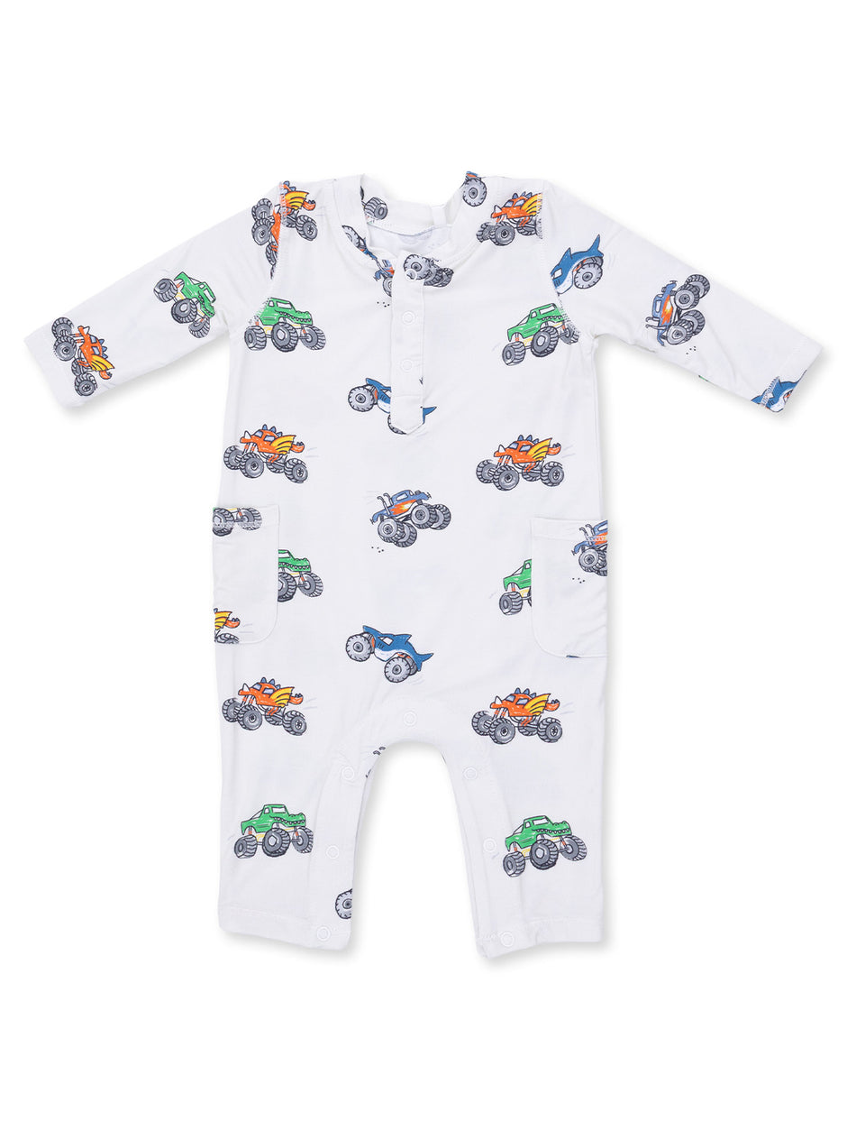 White baby onesie with colorful monster truck patterns. Ideal for playful and comfy wear.