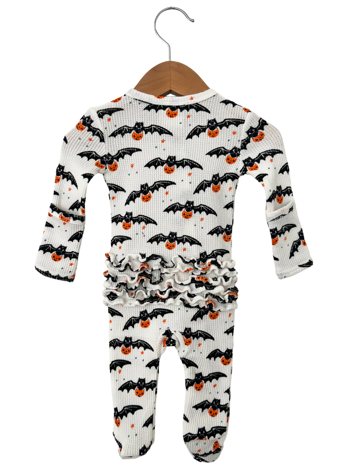 Halloween infant pajamas with bat and pumpkin prints, featuring ruffled design and long sleeves. 