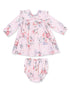 Pink floral baby dress with matching bloomers, featuring long sleeves and a ruffled collar.