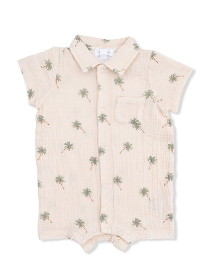 Light-colored infant romper with palm tree print and short sleeves.