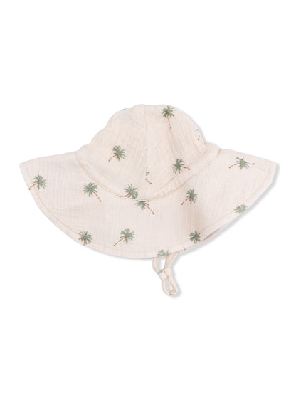 Beige sun hat with a wide brim and green palm tree pattern, ideal for outdoor activities and sun protection.