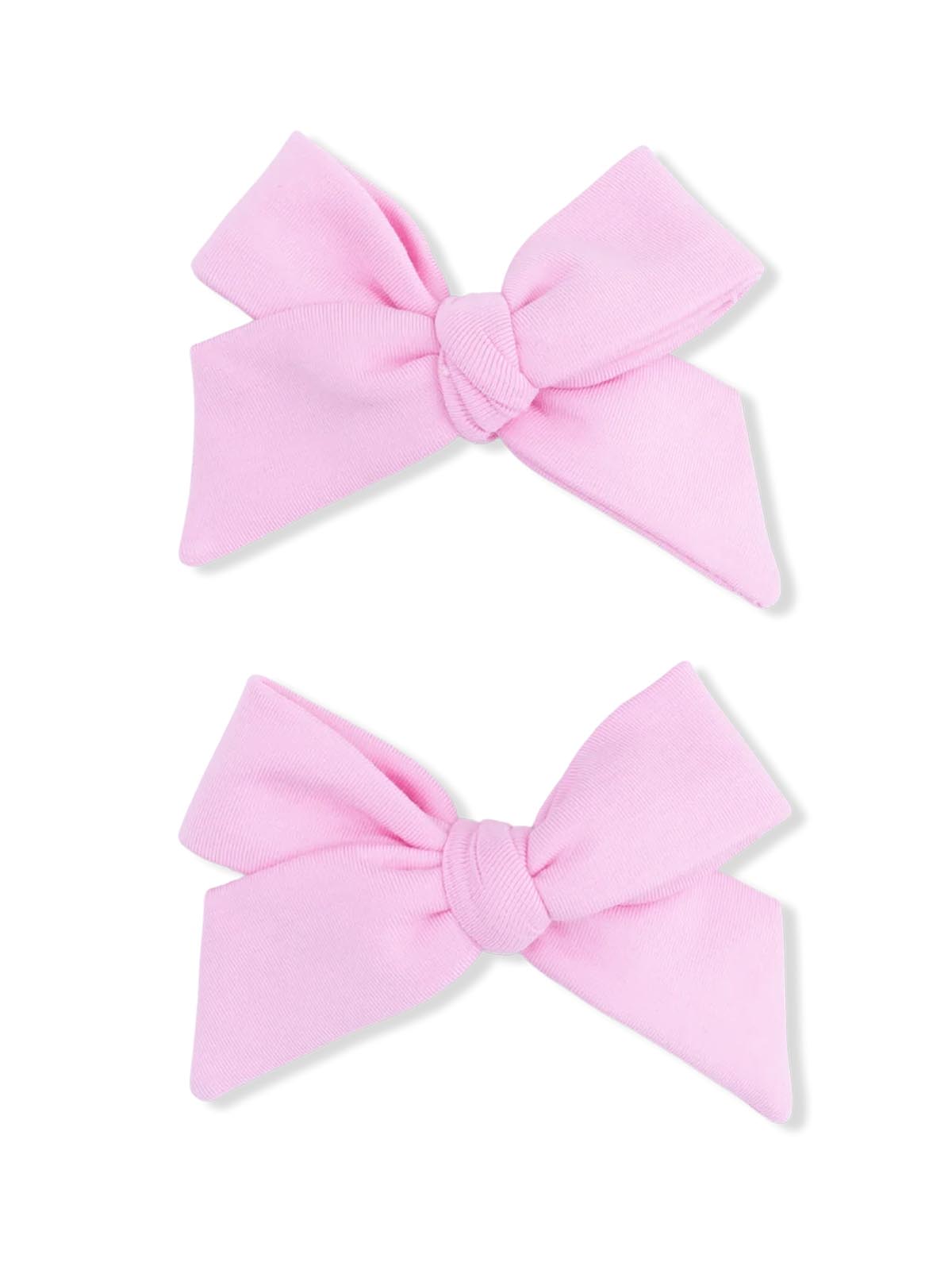 Two pink fabric hair bows with a knotted center, perfect for children's hairstyles.