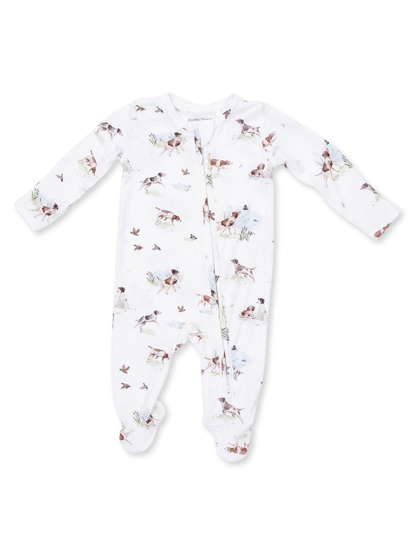 White baby onesie with dog and bird prints, featuring long sleeves and zipper closure. Perfect for comfort and style.