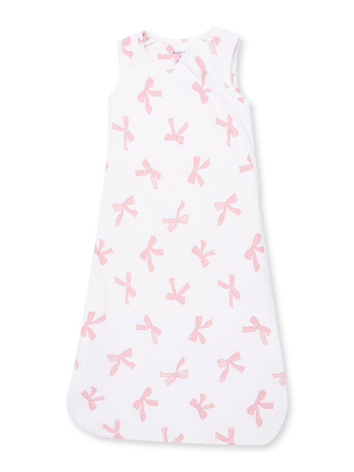 White sleeveless sleep sack with pink bows pattern for babies.