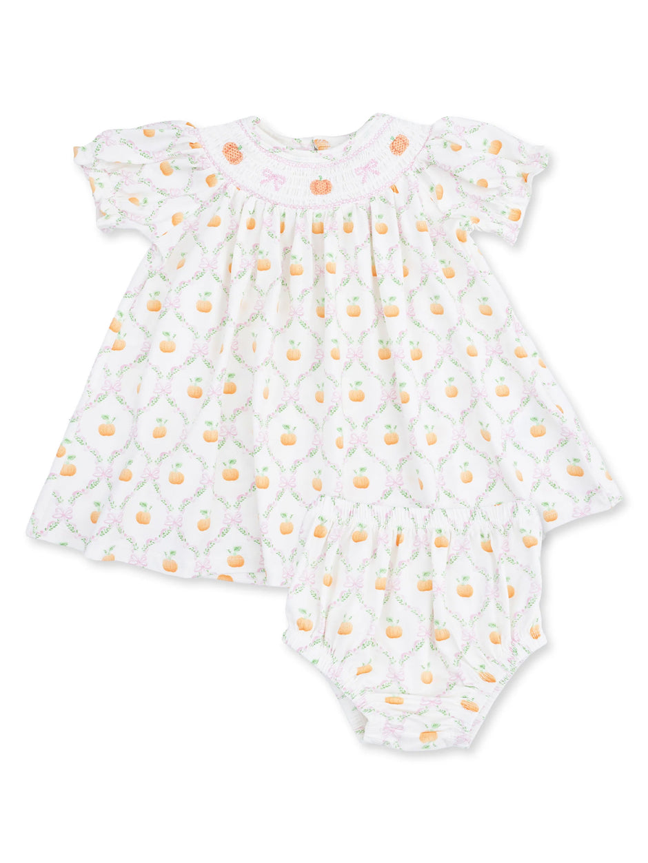 White toddler dress with floral pumpkin print, featuring short sleeves and matching bloomers.