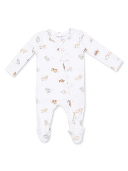 White baby onesie with long sleeves and a zipper, featuring a playful print of puppies.