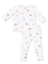 White infant pajamas with cute dog illustrations, featuring a top and matching pants.