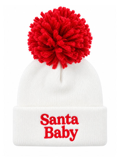 White knitted beanie with a large red pom-pom and "Santa Baby" embroidered in red on the cuff.