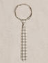 Gray and cream checkered tie laid flat on a light textured background.