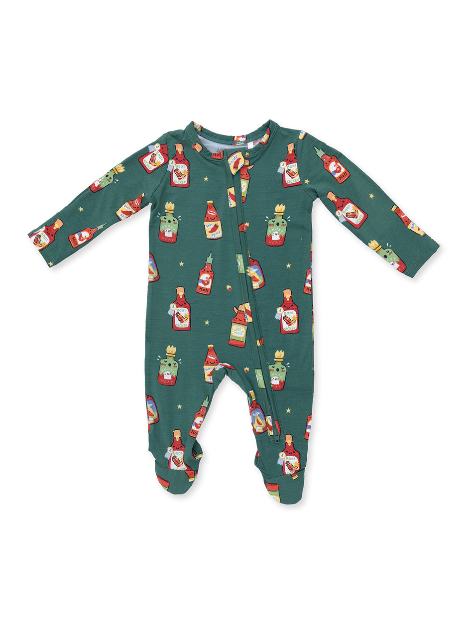 Green baby onesie featuring colorful cartoon food bottles and spicy themes.