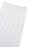 White fabric with a navy blue polka dot pattern, folded at an angle.