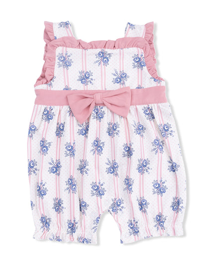 Floral patterned baby romper with ruffled straps and a pink bow at the waist, featuring white and pink stripes.