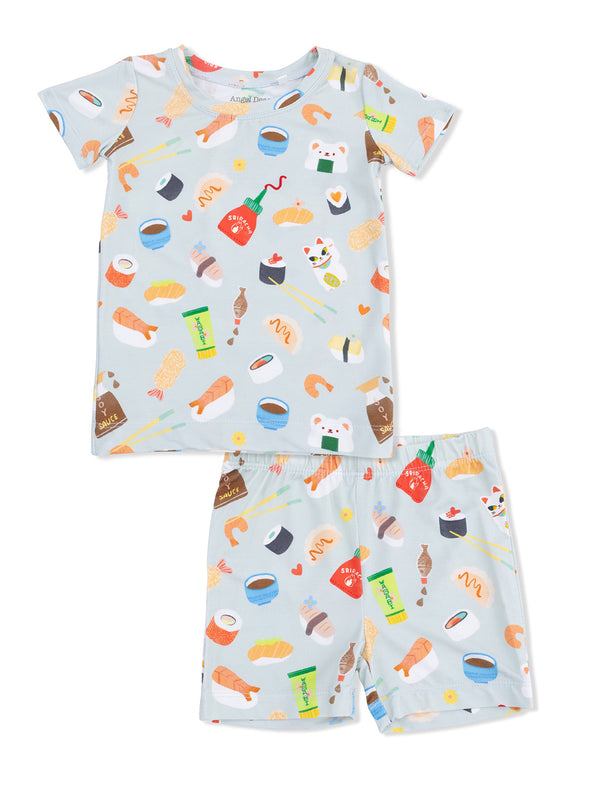 Light blue kids' pajamas featuring cute food patterns like sushi, shrimp, and sauces. Short-sleeve top and shorts design.