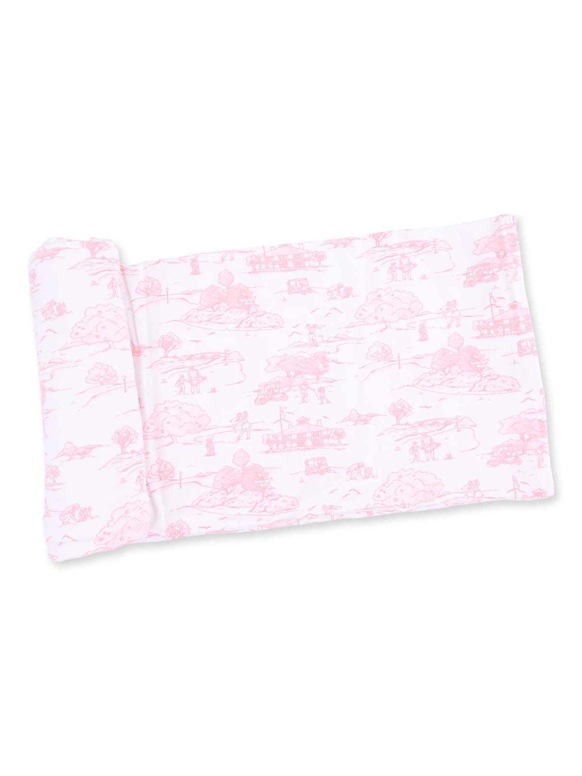 Pink patterned pillowcase featuring scenic illustrations of trees and rural landscapes.
