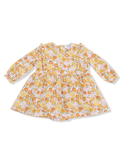 Floral patterned dress with long sleeves, featuring shades of orange, yellow, and pink on a light background.