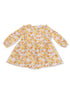 Floral patterned dress with long sleeves, featuring shades of orange, yellow, and pink on a light background.