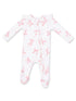 White infant onesie with pink bow prints and ruffled sleeves, featuring a front zipper and footed design.