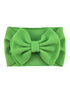 Bright green fabric headband with a large textured bow in the center. Ideal for kids or fashion accessories.