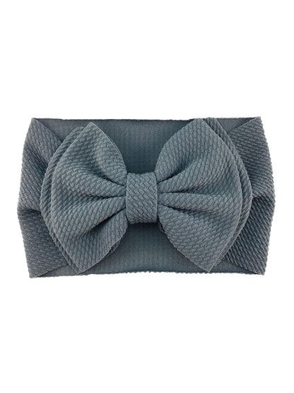 Gray fabric headband with a large, textured bow on the front.