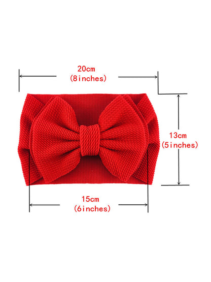 Red fabric hair bow with dimensions: 20cm wide, 15cm tall, 13cm deep, featuring a central knot.