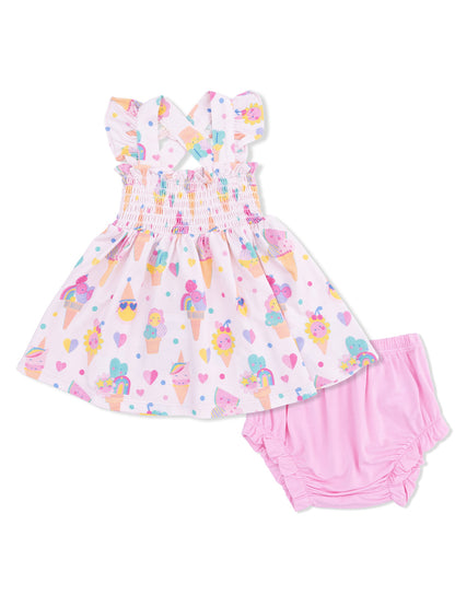 Girls' sundress with ice cream and heart patterns, paired with matching pink shorts.