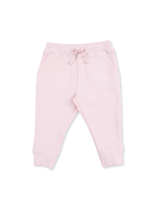 Light pink sweatpants with elastic waistband and drawstring, featuring two front pockets.