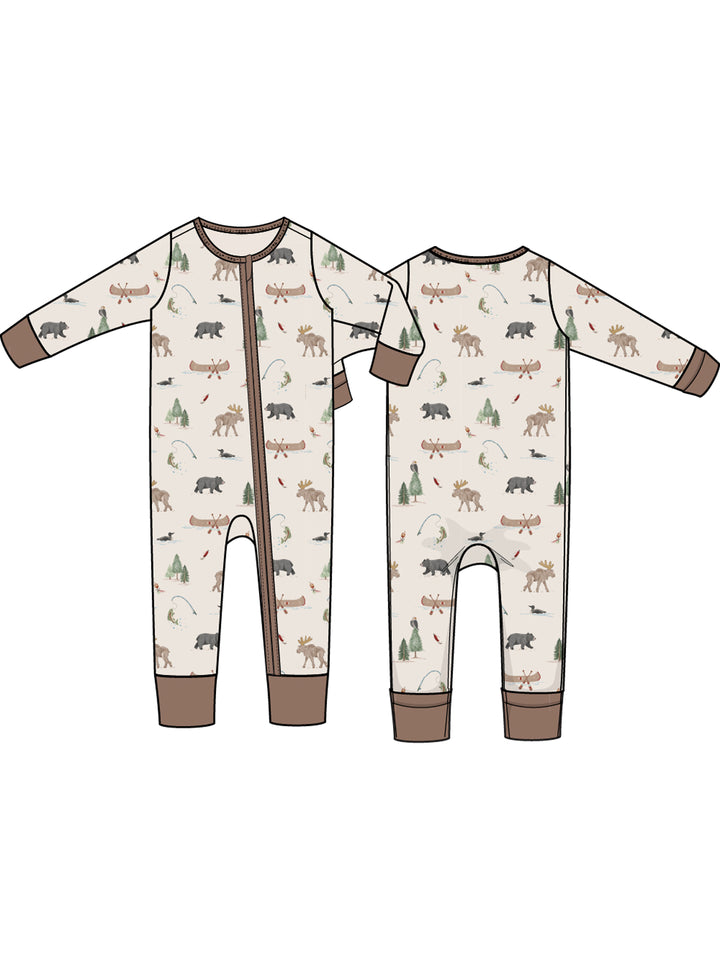 Children's one-piece pajamas featuring bears, moose, canoes, and trees in earthy tones. Front and back view shown.