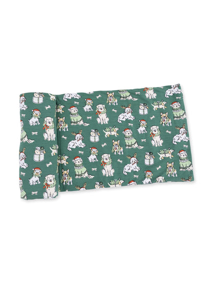 Green fabric featuring various cartoon dogs in festive attire and holiday themes.