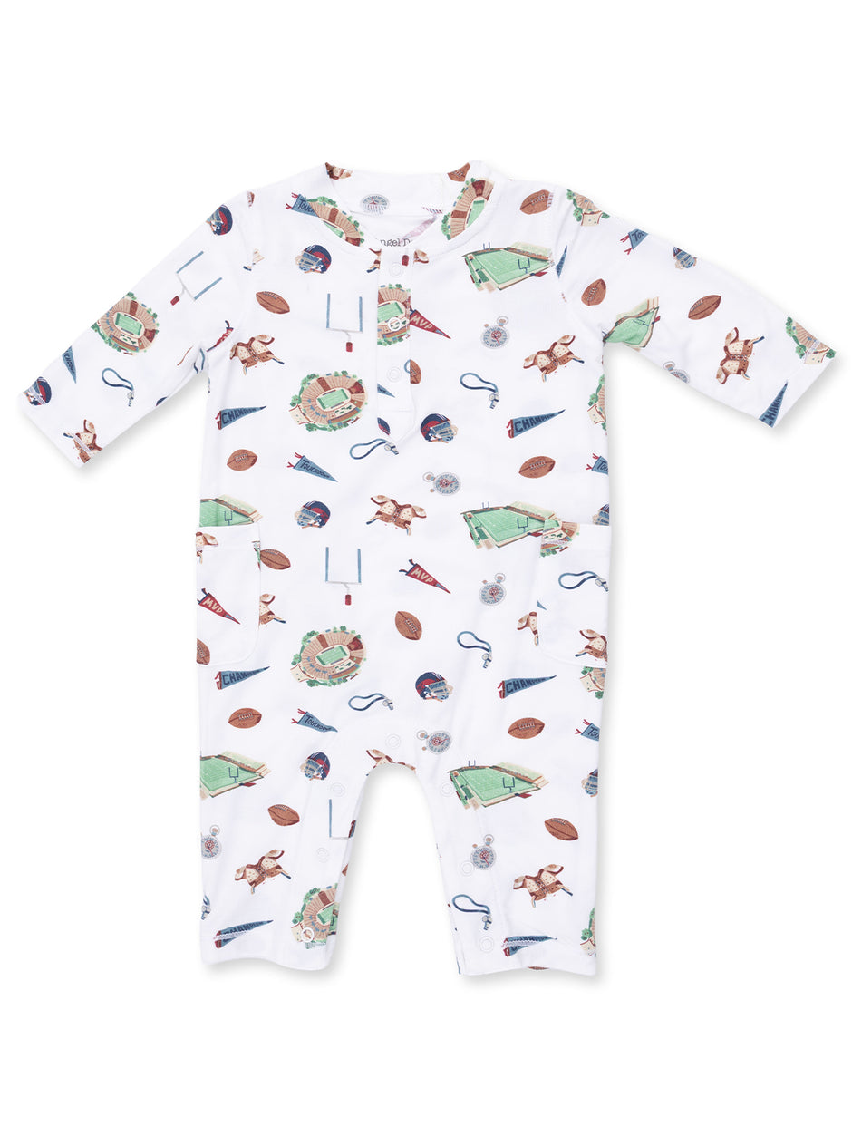 White baby onesie featuring playful sports-themed patterns including footballs, stadiums, and pennants.