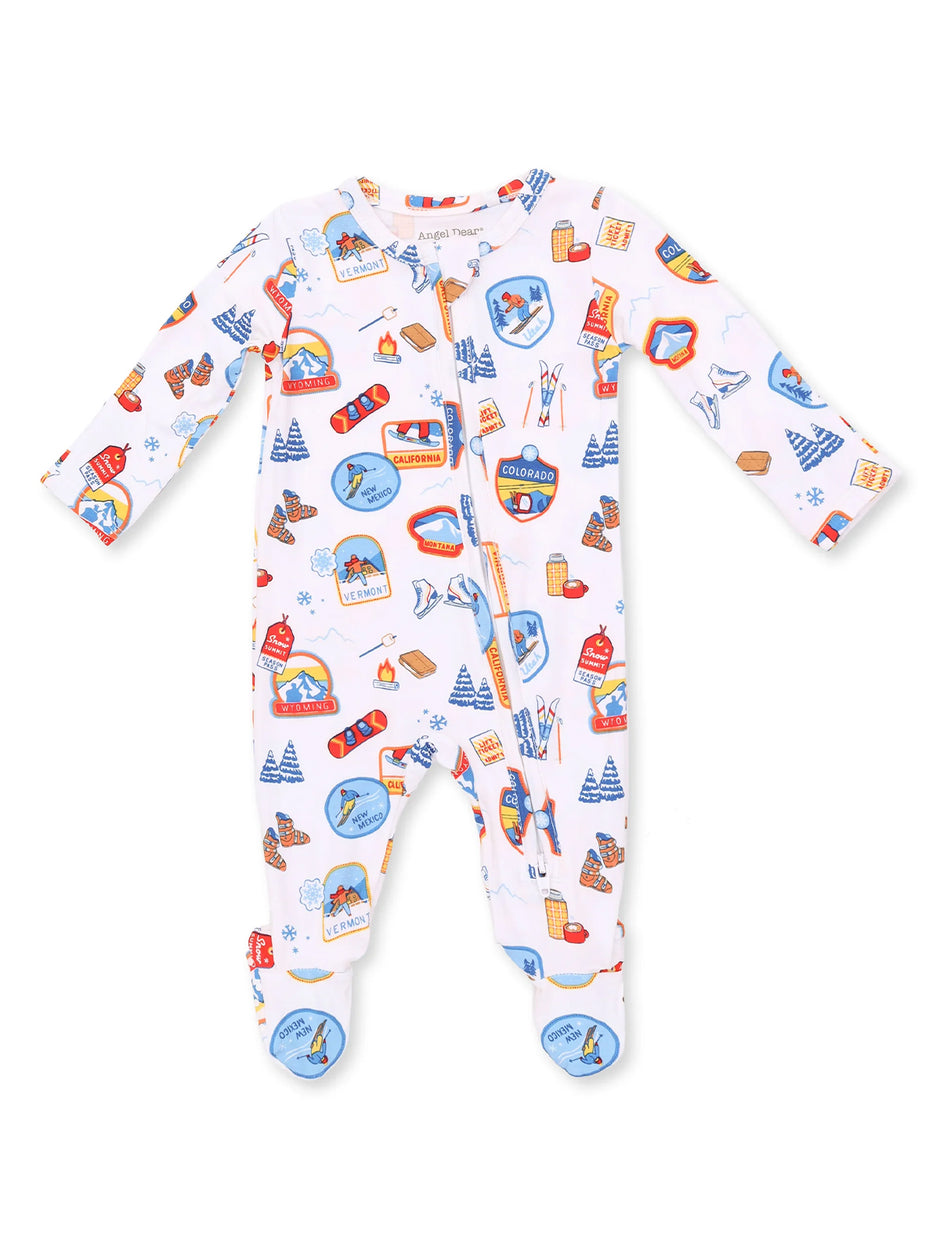 Infant pajamas with colorful travel-themed graphics, featuring long sleeves and footed design.