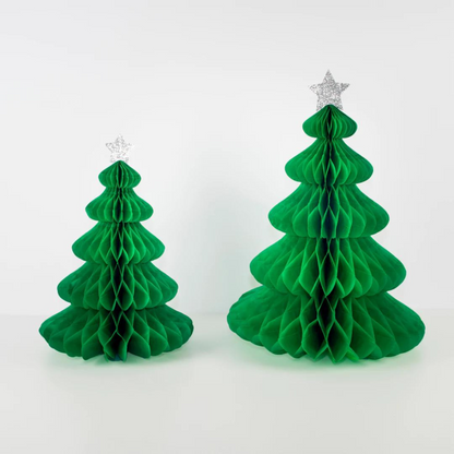 Two green paper honeycomb Christmas trees, one smaller, both topped with silver star ornaments against a white background.